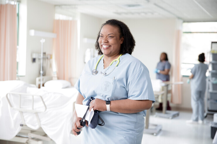 links to A smiling nursing student at Brightpoint.