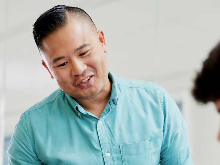 khiem tran speaking to a student