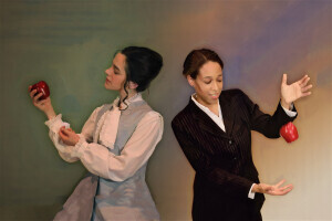 Two actors posing with apples