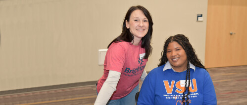 A Brightpoint advisor stands next to a VSU representative at a transfer event.
