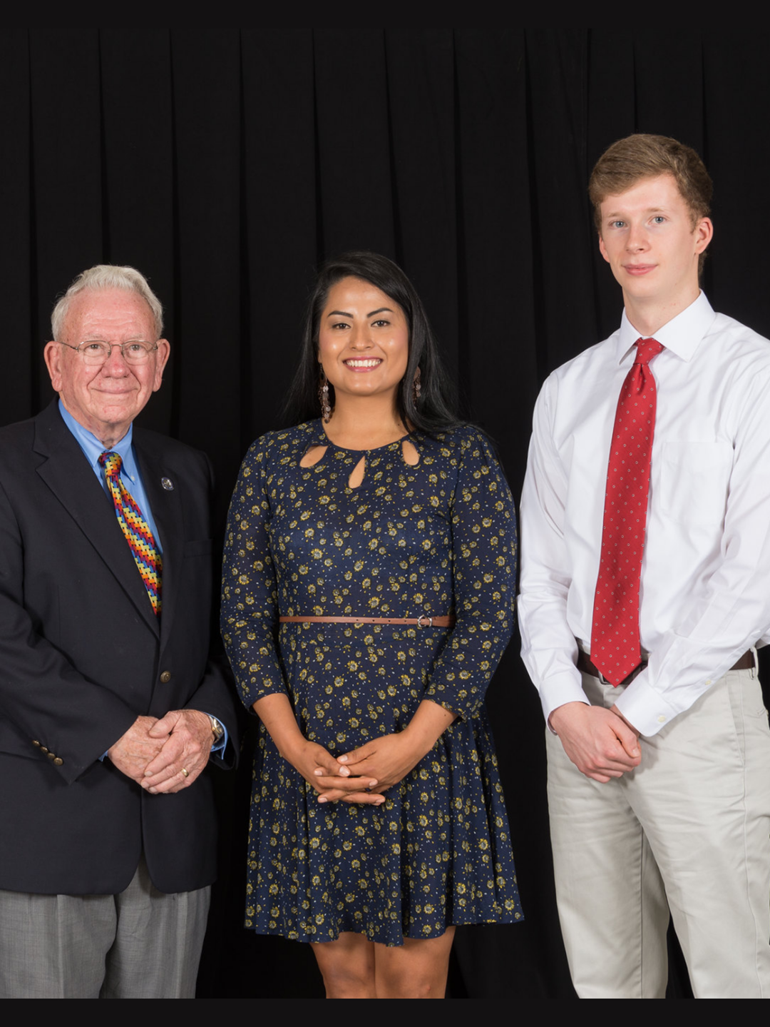 Ben poses next to other scholarship celebration attendees and the late William H. Talley III.