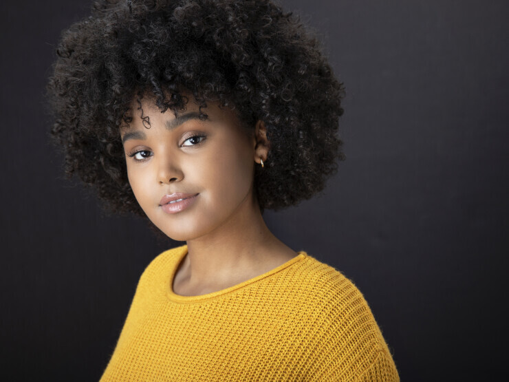 A young woman named Catherine Owens smiles softly. 