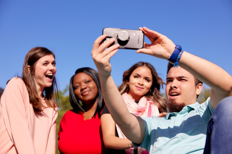 A group of students take a selfie while outside on Brightpoint's Midlothian Campus. 