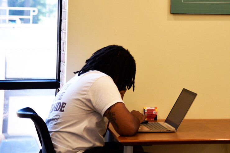 A Brightpoint student studying on their laptop. 