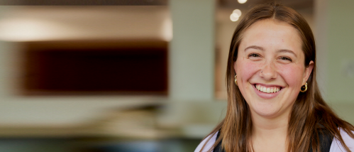 A Brightpoint student smiles while standing in the student lounge at the Chester Campus.