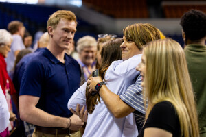 Brightpoint graduates hug friends and family after a nursing pinning ceremony. 