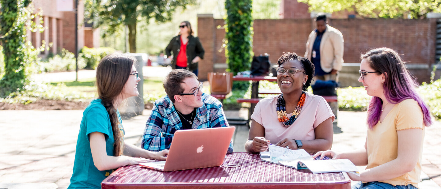 Students and staff in conversation