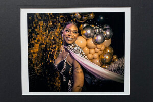 Photograph of woman wearing a cape.