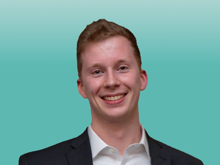Ben Brooks wears professional attire and smiles. 